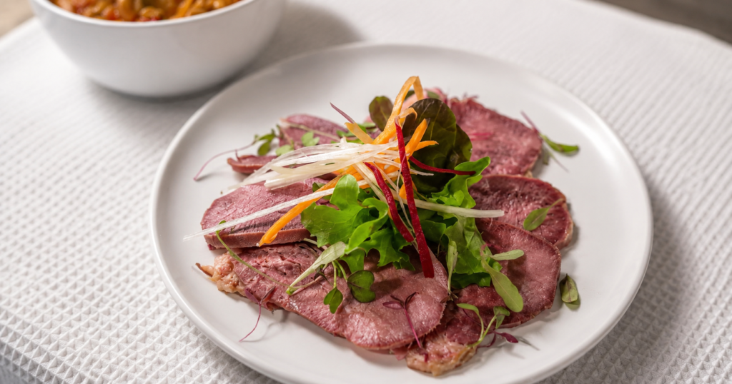Plated ox tongue dish prepared by BontleFela for an elegant Johannesburg celebration